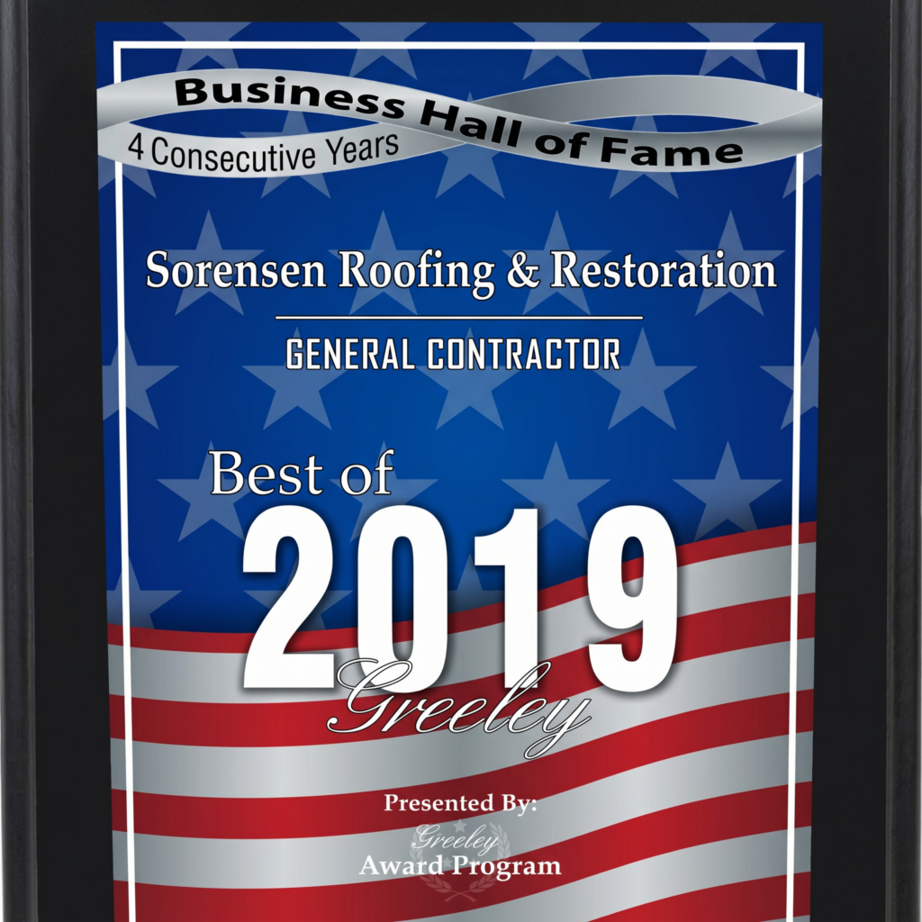 Sorensen Roofing & Restoration Business Hall of Fame award plaque, featuring "Best of 2019 Greeley," with American flag background and recognition as a general contractor.